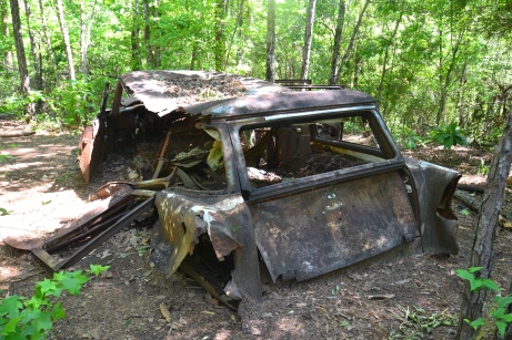 The rusted cars were unexpected on the trail.